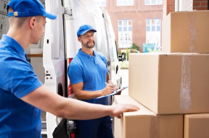 Moving helper unloading a truck